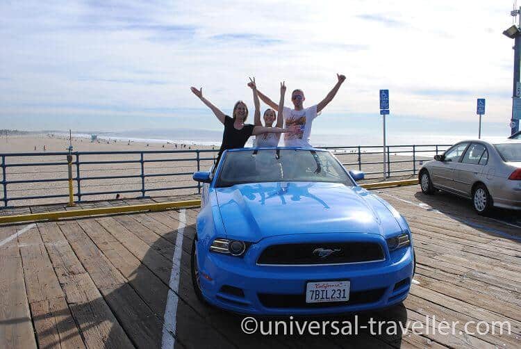 With a Ford Mustang at Santa Monica Pier, Los Angeles.