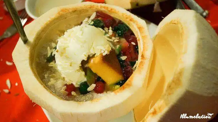 Filipino halo-halo dessert inside a coconut.