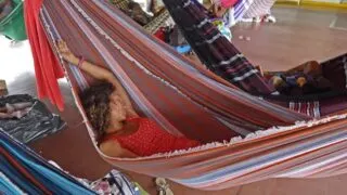Alya in her hammock slowboat down the Amazon