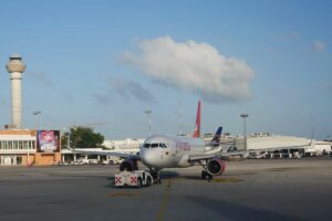 how to get from Isla Mujeres to Cancun Airport