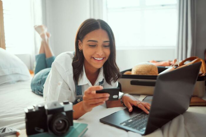 Young Woman Using Her Electronical Devices In A Hotel